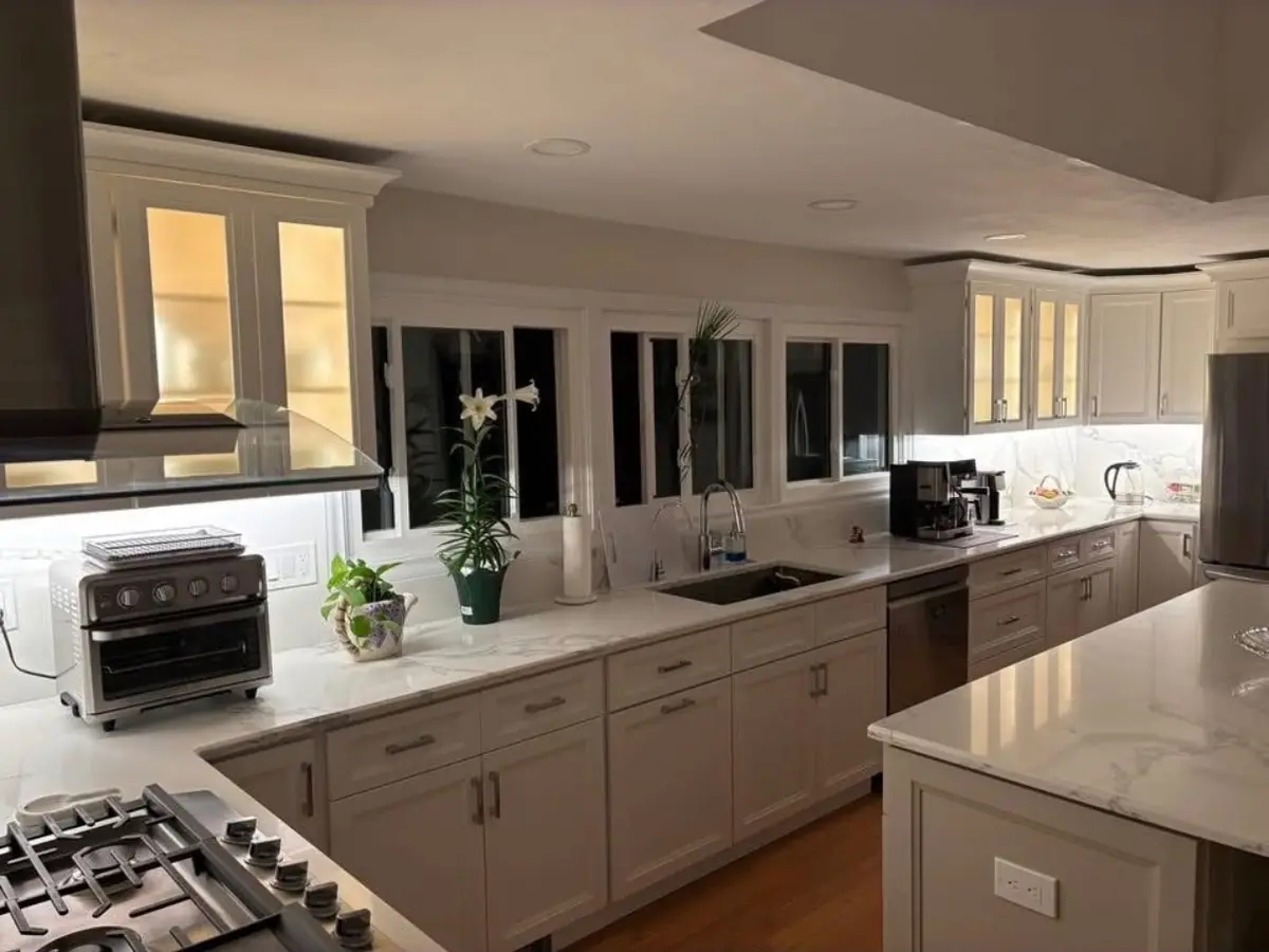 Kitchen with under-cabinet and glass-cabinet lighting installed by R.J.L Electric